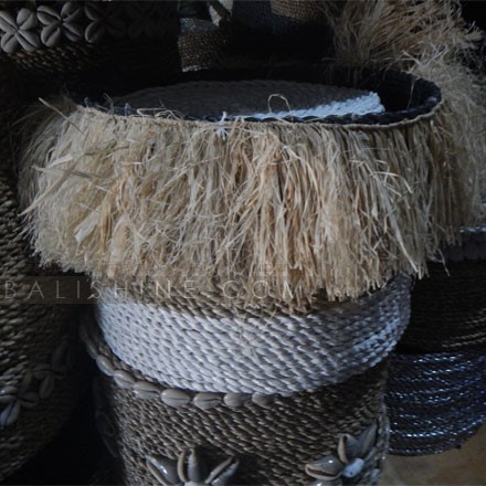 Balishine: Your natural source of indonesian handicraft presents in its Home Decor collection the Round Seagrass Rafia Tassel Fringe Basket:12JEN368097:Putting a unique twist on everyday essentials, this white and natural coloured seagrass basket will make a charming addition to your living space. Natural rafia fringe detailing adds a boho chic finishing touch.  Set of 3 pcs stackable. Other size and colors possible. Please contact us.