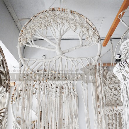 Balishine: Your natural source of indonesian handicraft presents in its Home Decor collection the Bohemian Tree of Life Macrame Wall Hanging:17NUS507976:This Bohemian Tree of Life Macrame Wall Hanging gracefully introduces texture, warmth and depth into tropical interior spaces and is a?perfect way to stylishly adorn?the wall of any room in the home.? This piece?is handmade?and framed by a round honey coloured rottan border.? Long tassels hang down.? These Tassels can be easily trimmed to suit your space.  Handmade, natural, 100% cotton. Available in white or light brown color.