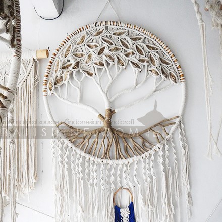 Balishine: Your natural source of indonesian handicraft presents in its Home Decor collection the Gipsy Tree of Life Macrame Wall Hanging:17NUS507977:This Gipsy Tree of Life Macrame Wall Hanging gracefully introduces texture, warmth and depth into tropical interior spaces and is a?perfect way to stylishly adorn?the wall of any room in the home.? This piece?is handmade?and framed by a round honey coloured rottan border.? Long tassels hang down.? These Tassels can be easily trimmed to suit your space.  Handmade, natural, 100% cotton. Available in white or light brown color.